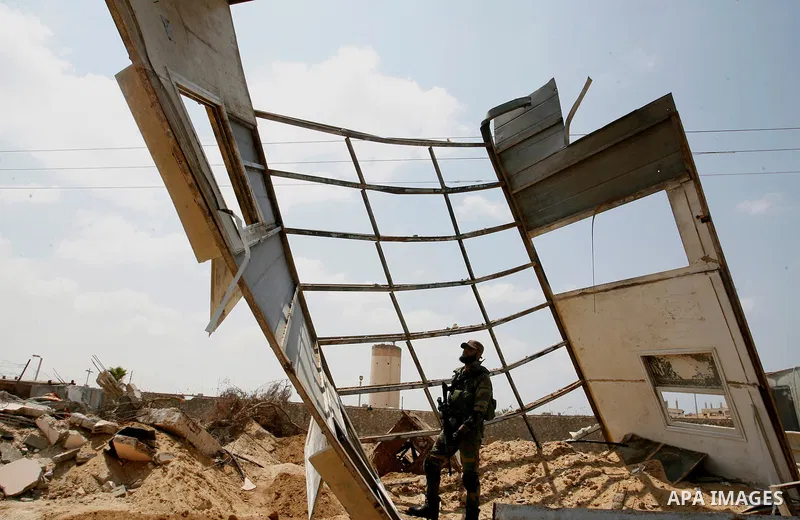 Palestinian security forces inspect security headquarters destroyed during fighting between Hamas militants and Israel on the border between Egypt and Gaza in Rafah, southern Gaza Strip in August 31, 2014. An indefinite...