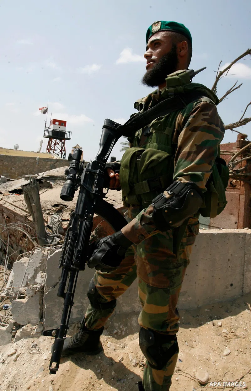 Palestinian security forces inspect security headquarters destroyed during fighting between Hamas militants and Israel on the border between Egypt and Gaza in Rafah, southern Gaza Strip in August 31, 2014. An indefinite...