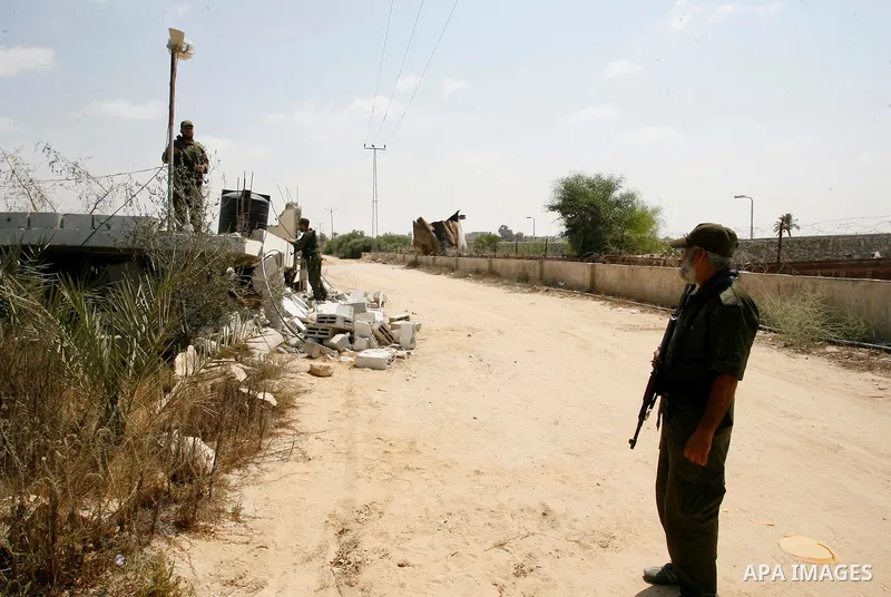 Palestinian security forces inspect security headquarters destroyed during fighting between Hamas militants and Israel on the border between Egypt and Gaza in Rafah, southern Gaza Strip in August 31, 2014. An indefinite...