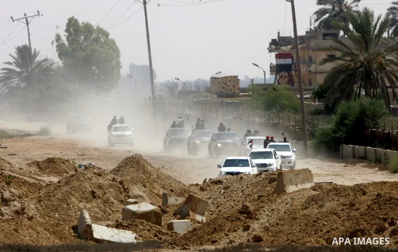 Palestinian security forces inspect security headquarters destroyed during fighting between Hamas militants and Israel on the border between Egypt and Gaza in Rafah, southern Gaza Strip in August 31, 2014. An indefinite...