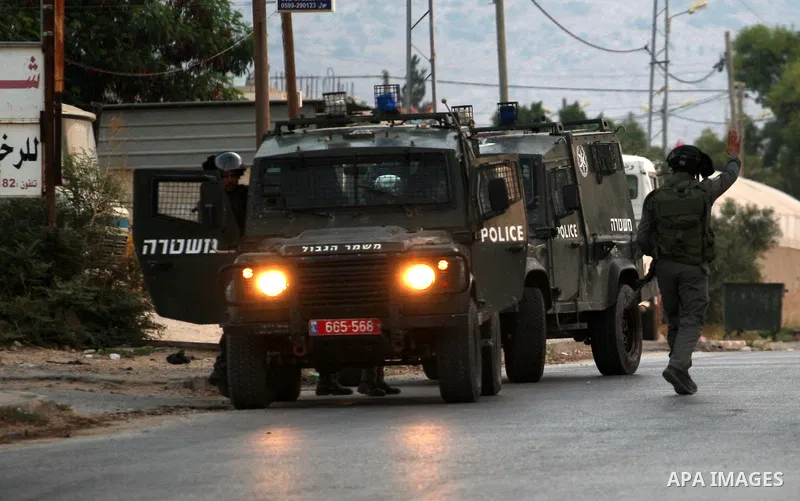 Israeli soldiers patrol the streets during a military operation at al-Faraa refugee camp near the West Bank City of Jenin on Sep. 01, 2014. Israeli soldiers raided many houses and detained 7 Palestinians. Photo by Nedal...