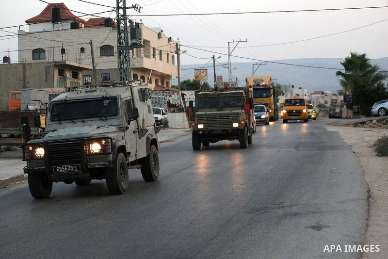 Israeli soldiers patrol the streets during a military operation at al-Faraa refugee camp near the West Bank City of Jenin on Sep. 01, 2014. Israeli soldiers raided many houses and detained 7 Palestinians. Photo by Nedal...