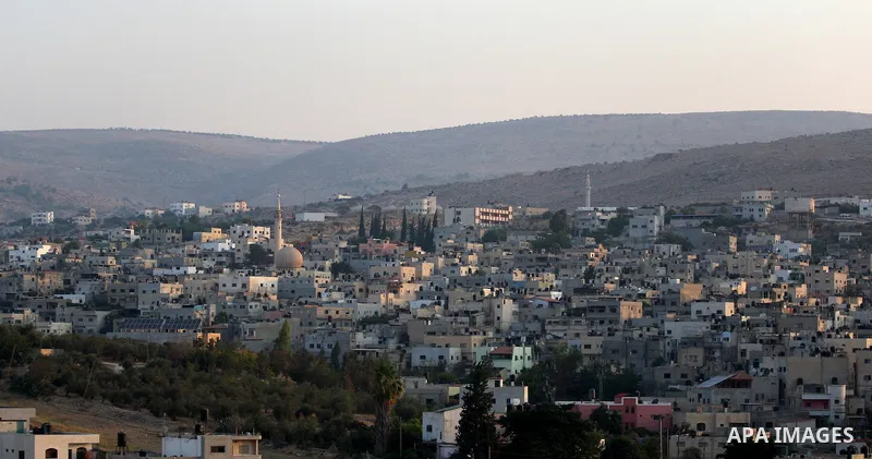 A general view shows the houses of al-Faraa refugee camp near the West Bank City of Jenin Sep. 01, 2014. Israeli soldiers raided many houses and detained 7 Palestinians. Photo by Nedal Eshtayah