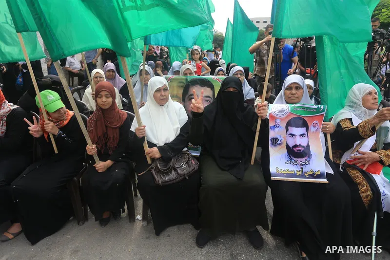 Palestinian women take part in a protest demanding the release of their relatives prisoners held in Israeli jails, in front of the Red Cross office in Gaza City, on Sep. 01, 2014. Photo by Mohammed Asad