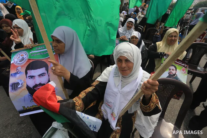 Palestinian women take part in a protest demanding the release of their relatives prisoners held in Israeli jails, in front of the Red Cross office in Gaza City, on Sep. 01, 2014. Photo by Mohammed Asad