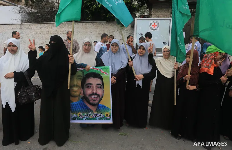 Palestinian women take part in a protest demanding the release of their relatives prisoners held in Israeli jails, in front of the Red Cross office in Gaza City, on Sep. 01, 2014. Photo by Mohammed Asad