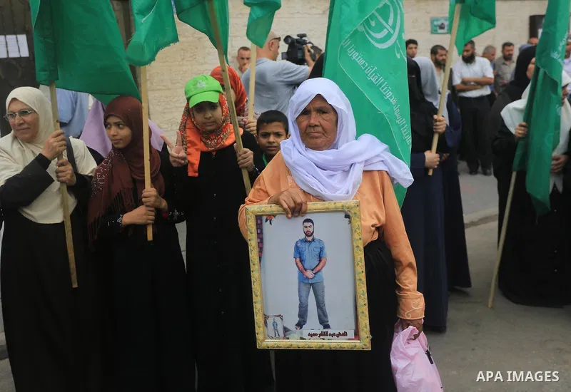 Palestinian women take part in a protest demanding the release of their relatives prisoners held in Israeli jails, in front of the Red Cross office in Gaza City, on Sep. 01, 2014. Photo by Mohammed Asad