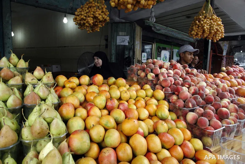 A Palestinian vendor sells fruits at his shop in Rafah in the southern Gaza Strip, o n Sep. 01, 2014. Calm returned to the coastal enclave in a August 26 ceasefire, and Gazans were gradually starting to rebuild their liv...
