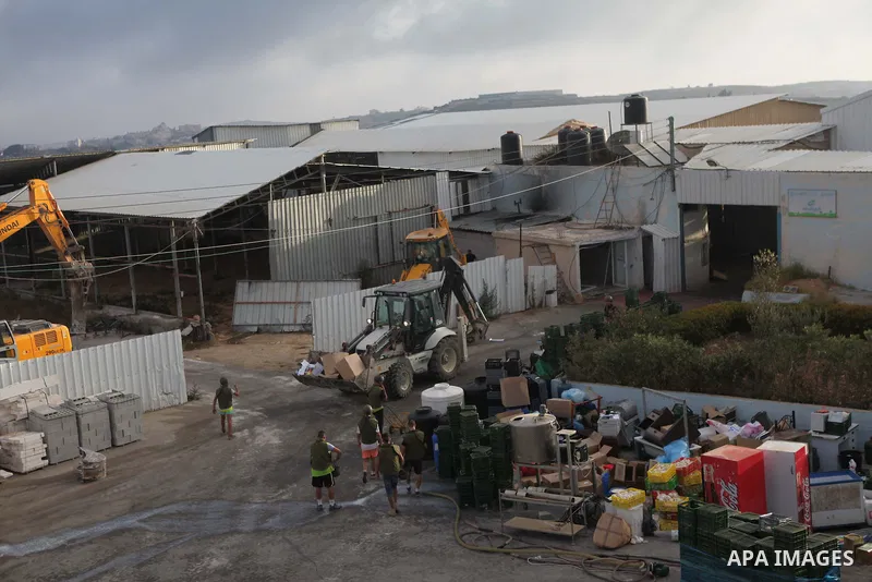 Israeli bulldozers demolish a dairy factory, at the al-Rama neighborhood near the West Bank city of Hebron on September 2, 2014. Israeli bulldozers demolished a dairy factory in Hebron and Bedouin homes east of Jerusalem...