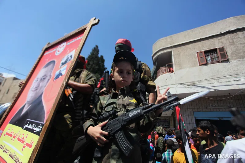 Palestinian militants from the Popular Front for the Liberation of Palestinian (PFLP) take part in a military show in Gaza City September 2, 2014. An open-ended ceasefire between Israel and Hamas-led Gaza militants, medi...
