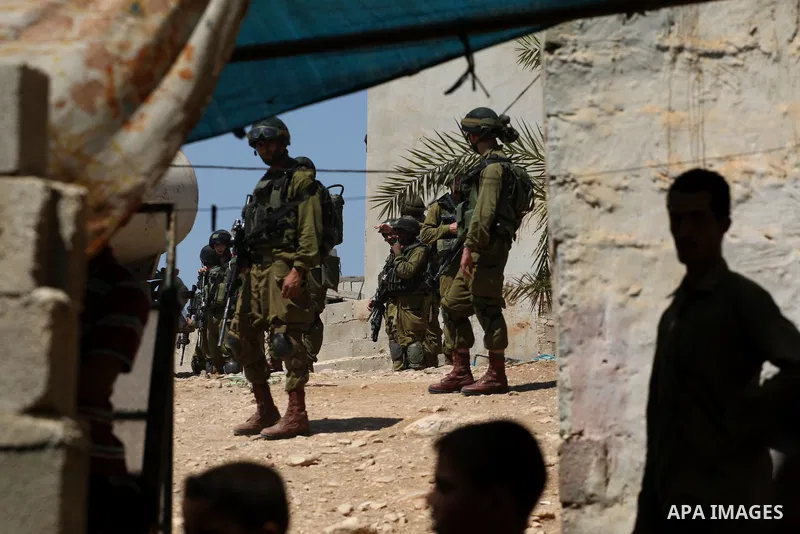 Israeli military patrol the streets during a military operation at Al-Nassariya village near the West Bank city of Nablus, on Sep. 04, 2014. Photo by Nedal Eshtayah