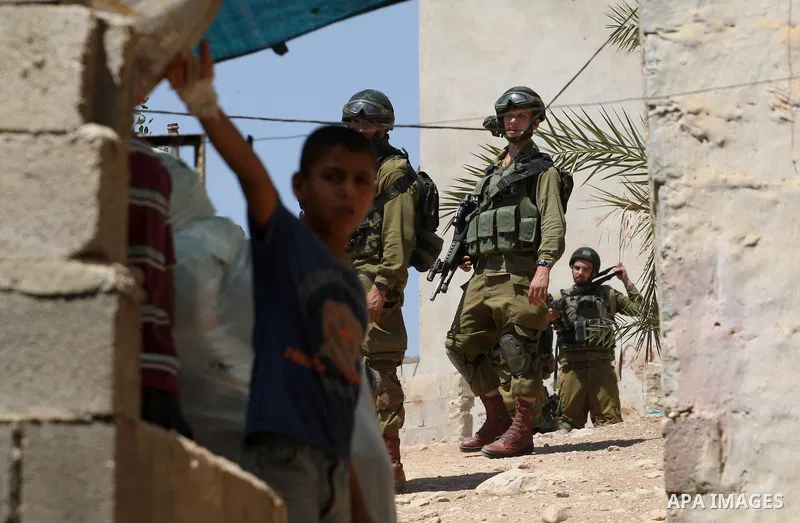 Israeli military patrol the streets during a military operation at Al-Nassariya village near the West Bank city of Nablus, on Sep. 04, 2014. Photo by Nedal Eshtayah