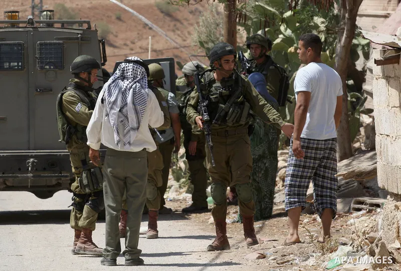 Israeli military patrol the streets during a military operation at Al-Nassariya village near the West Bank city of Nablus, on Sep. 04, 2014. Photo by Nedal Eshtayah