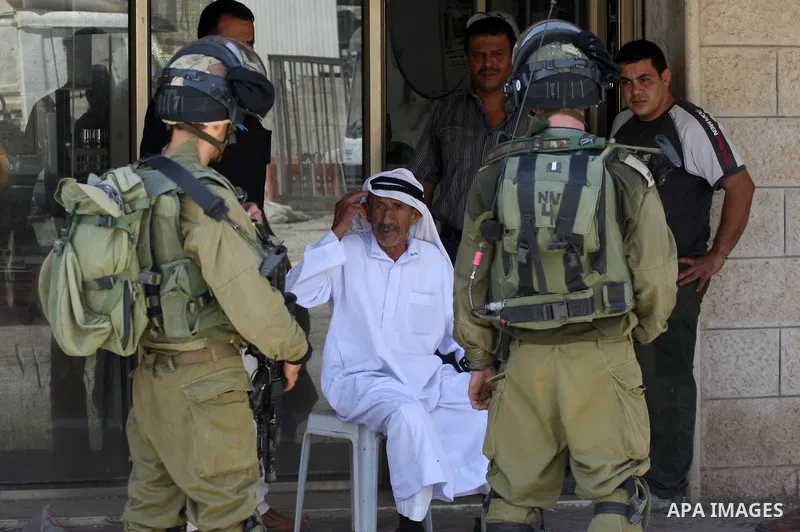 Israeli military patrol the streets during a military operation at Al-Nassariya village near the West Bank city of Nablus, on Sep. 04, 2014. Photo by Nedal Eshtayah