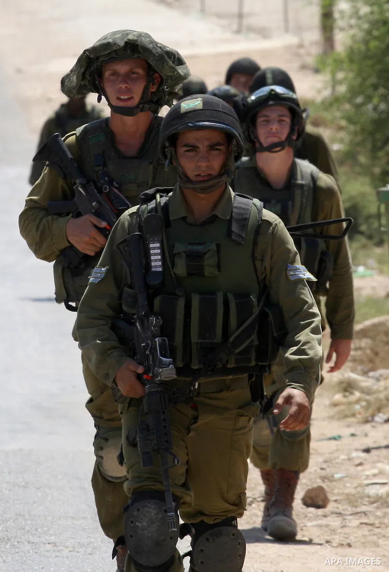 Israeli military patrol the streets during a military operation at Al-Nassariya village near the West Bank city of Nablus, on Sep. 04, 2014. Photo by Nedal Eshtayah