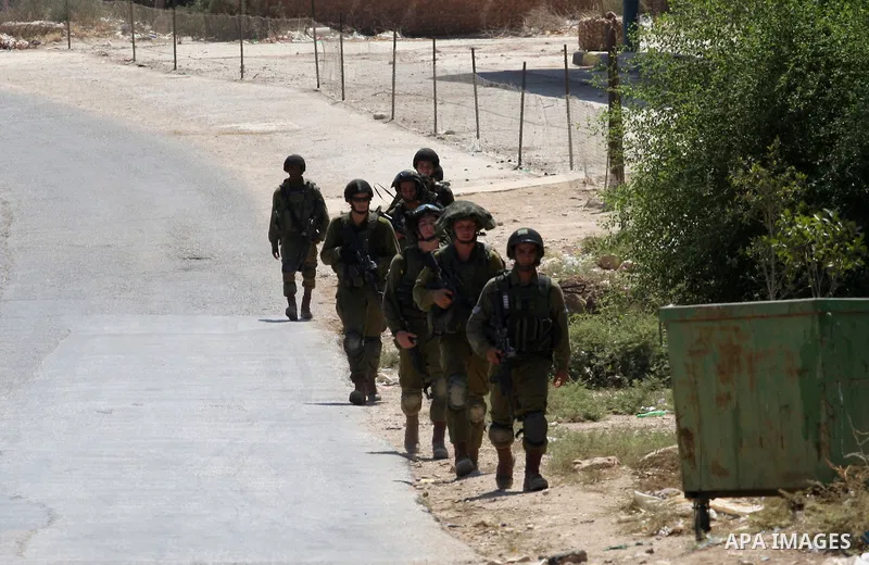 Israeli military patrol the streets during a military operation at Al-Nassariya village near the West Bank city of Nablus, on Sep. 04, 2014. Photo by Nedal Eshtayah