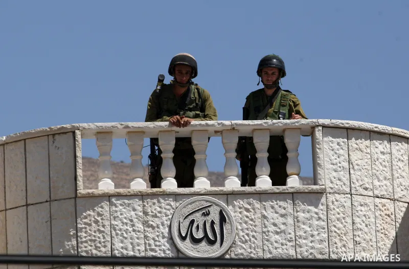 Israeli military patrol the streets during a military operation at Al-Nassariya village near the West Bank city of Nablus, on Sep. 04, 2014. Photo by Nedal Eshtayah