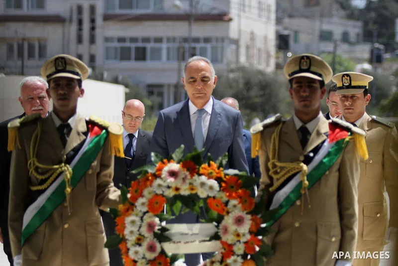 Salah-Eddine Mezouar, Morocco Minister of Foreign, lays a wreath at the grave of the late Palestinian chairman Yasser Arafat, in the West bank city of Ramallah on September 4, 2014. Photo by Shadi Hatem