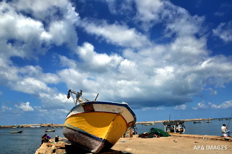 A Palestinian fisherman casts his net at Gaza's seaport in Gaza City on Sep. 06 2014. Israel and Hamas accepted an Egyptian proposal for a long-term ceasefire in war-torn Gaza. Restrictions imposed on Gaza fishermen are...
