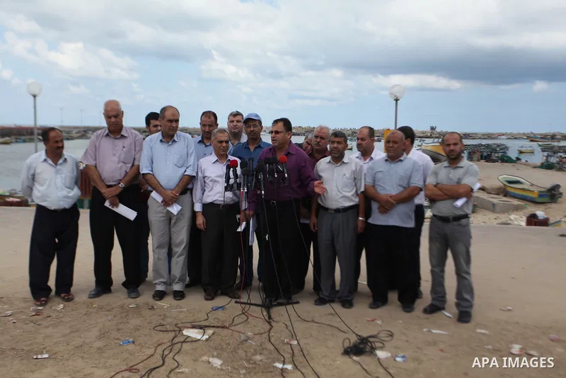 Director of Planning and Policies the Ministry of Agriculture, Nabil Abu Shamala, speaks during a press conference, at Gaza's seaport in Gaza City on Sep. 06, 2014. Photo by Ashraf Amra