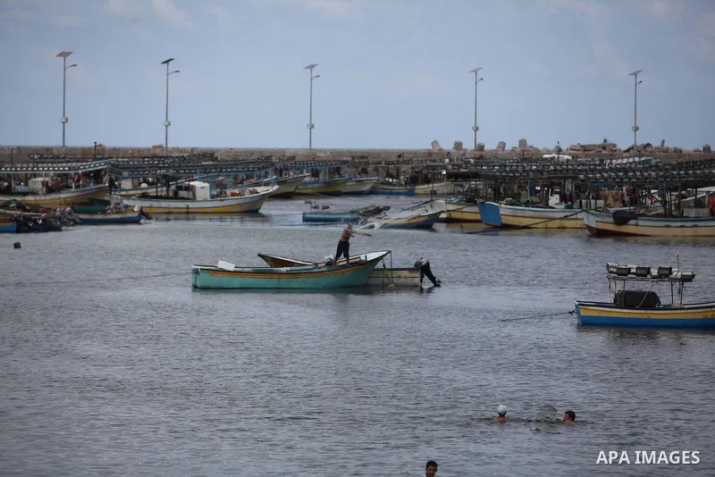 Palestinian fishermen cast their nets at Gaza's seaport in Gaza City on Sep. 06 2014. Israel and Hamas accepted an Egyptian proposal for a long-term ceasefire in war-torn Gaza. Restrictions imposed on Gaza fishermen are...