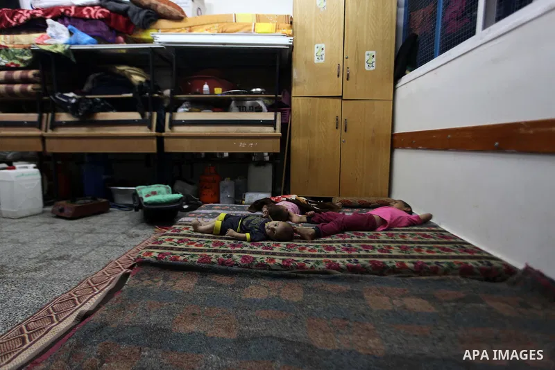 Palestinian displaced children sleep at a UN school in Beit Hanoun in northern Gaza strip on Sep. 07, 2014. Calm returned to the coastal enclave in a August 26 ceasefire, and Gazans were gradually starting to rebuild the...