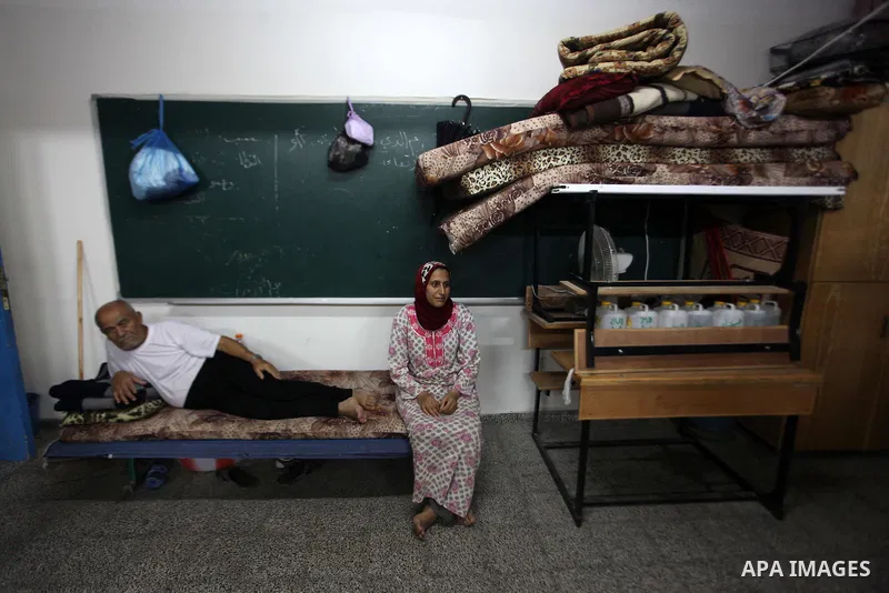 Palestinian displaced sit at a UN school in Beit Hanoun in northern Gaza strip on Sep. 07, 2014. Calm returned to the coastal enclave in a August 26 ceasefire, and Gazans were gradually starting to rebuild their lives af...