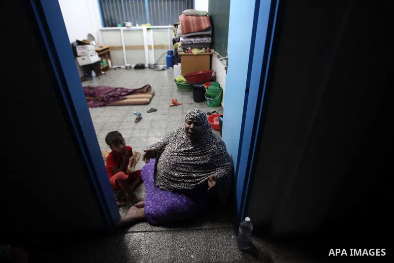 Palestinian displaced sit at a UN school in Beit Hanoun in northern Gaza strip on Sep. 07, 2014. Calm returned to the coastal enclave in a August 26 ceasefire, and Gazans were gradually starting to rebuild their lives af...