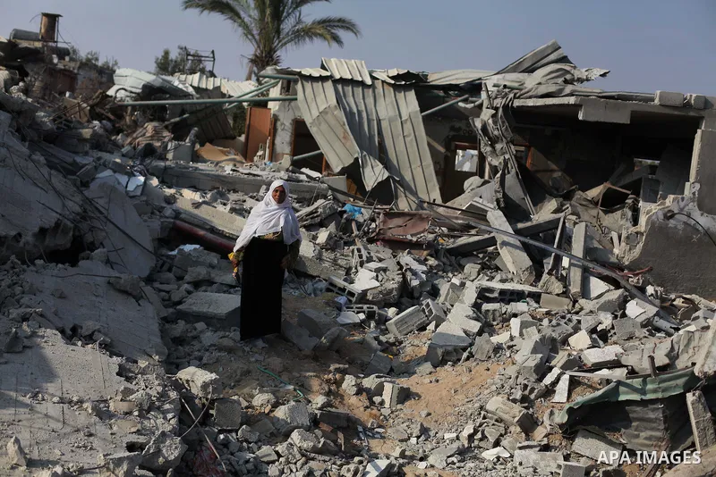 A Palestinian Bedouin stands on the rubble of her house which destroyed during fighting between Hamas militants and Israel in the center of Gaza strip on September 08, 2014. Calm returned to the coastal enclave in a Augu...