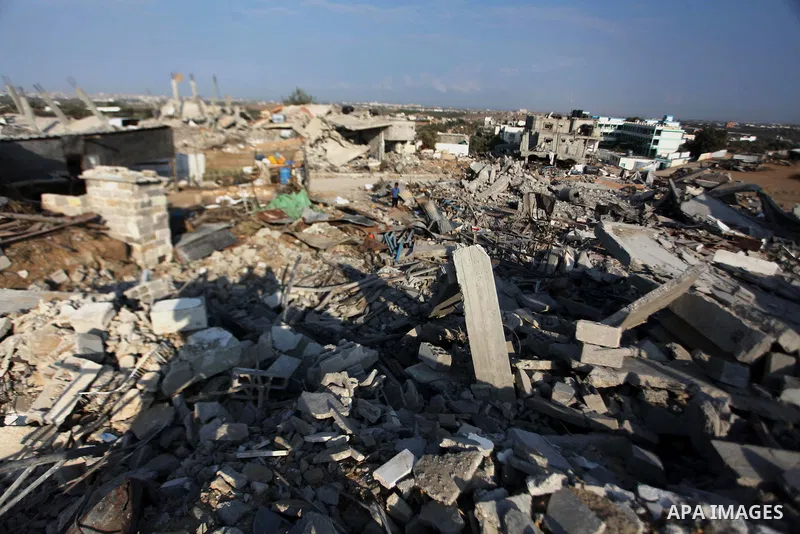 Palestinians gather around the rubble of his house which destroyed during fighting between Hamas militants and Israel in the center of Gaza strip on September 08, 2014. Calm returned to the coastal enclave in a August 26...