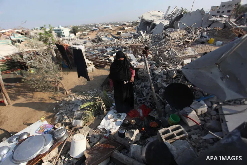 A Palestinian Bedouin stands on the rubble of her house which destroyed during fighting between Hamas militants and Israel in the center of Gaza strip on September 08, 2014. Calm returned to the coastal enclave in a Augu...