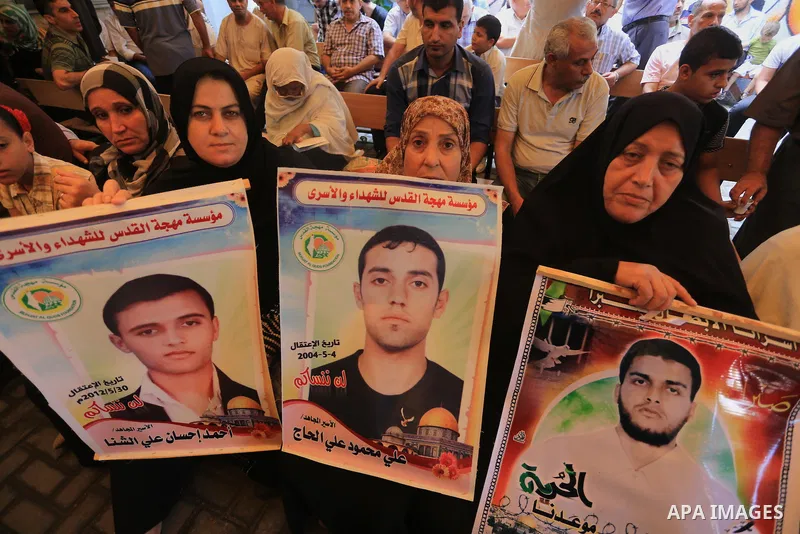 Palestinian women take part in a protest demanding the release of their relatives prisoners held in Israeli jails, in front of the Red Cross office in Gaza City, on Sep. 08, 2014. Photo by Mohammed Asad
