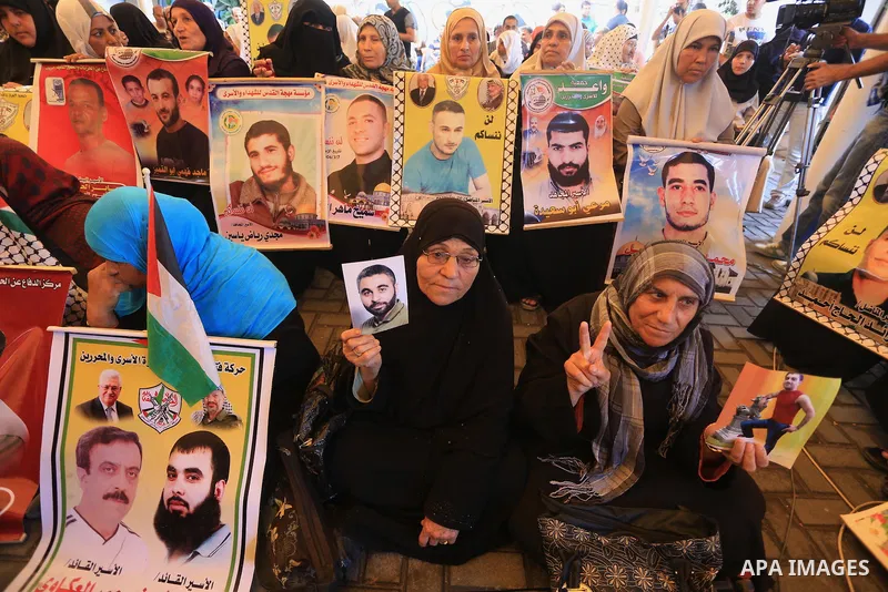 Palestinian women take part in a protest demanding the release of their relatives prisoners held in Israeli jails, in front of the Red Cross office in Gaza City, on Sep. 08, 2014. Photo by Mohammed Asad