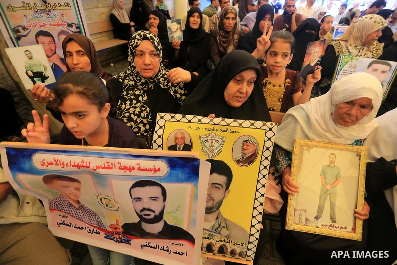 Palestinian women take part in a protest demanding the release of their relatives prisoners held in Israeli jails, in front of the Red Cross office in Gaza City, on Sep. 08, 2014. Photo by Mohammed Asad