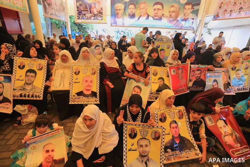 Palestinian women take part in a protest demanding the release of their relatives prisoners held in Israeli jails, in front of the Red Cross office in Gaza City, on Sep. 08, 2014. Photo by Mohammed Asad