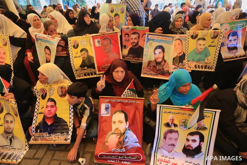 Palestinian women take part in a protest demanding the release of their relatives prisoners held in Israeli jails, in front of the Red Cross office in Gaza City, on Sep. 08, 2014. Photo by Mohammed Asad