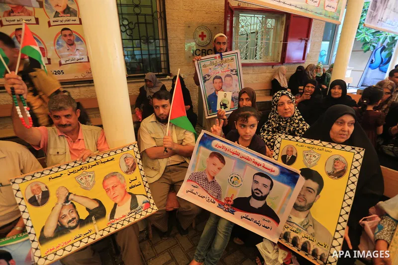 Palestinian women take part in a protest demanding the release of their relatives prisoners held in Israeli jails, in front of the Red Cross office in Gaza City, on Sep. 08, 2014. Photo by Mohammed Asad
