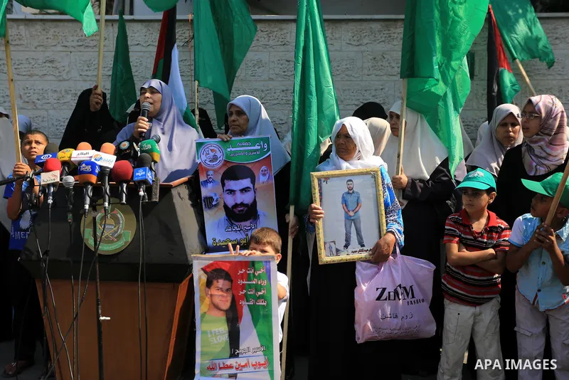 Palestinian women take part in a protest demanding the release of their relatives prisoners held in Israeli jails, in front of the Red Cross office in Gaza City, on Sep. 08, 2014. Photo by Mohammed Asad
