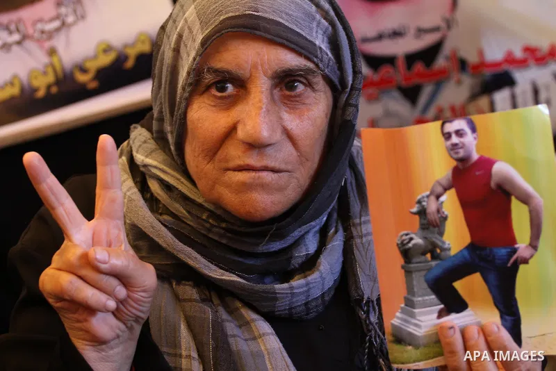 Palestinian women take part in a protest demanding the release of their relatives prisoners held in Israeli jails, in front of the Red Cross office in Gaza City, on Sep. 08, 2014. Photo by Mohammed Asad