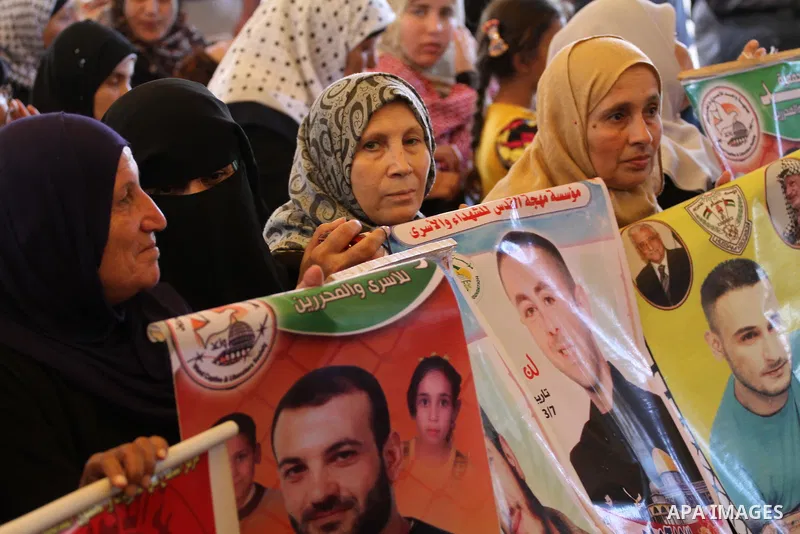 Palestinian women take part in a protest demanding the release of their relatives prisoners held in Israeli jails, in front of the Red Cross office in Gaza City, on Sep. 08, 2014. Photo by Mohammed Asad