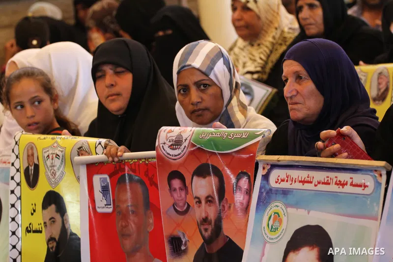 Palestinian women take part in a protest demanding the release of their relatives prisoners held in Israeli jails, in front of the Red Cross office in Gaza City, on Sep. 08, 2014. Photo by Mohammed Asad