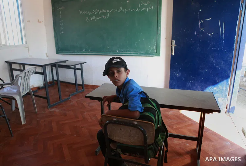 A Palestinian Bedouin Student learns at Arab Al-Ka'abneh school in Al-Mu'arrajat area near the West Bank city of Jericho, on Sep. 08, 2014. Dozens of Palestinian children in the ramshackle Bedouin community outside Jerus...