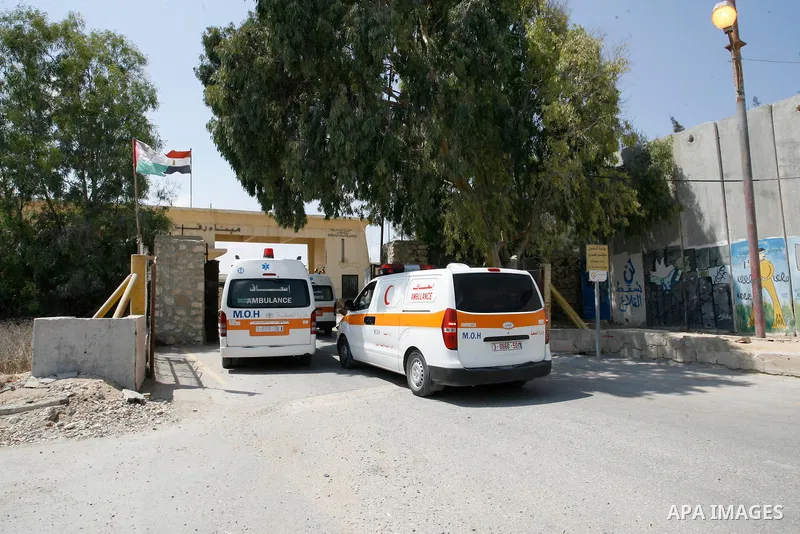Palestinians ride an ambulance as they wait to be given the permission to cross into Egypt at the Rafah border crossing in the southern Gaza Strip, on Sep. 08, 2014. Calm returned to the coastal enclave in a August 26 ce...