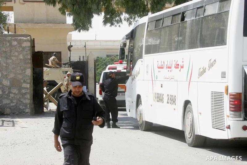 Palestinians ride an ambulance as they wait to be given the permission to cross into Egypt at the Rafah border crossing in the southern Gaza Strip, on Sep. 08, 2014. Calm returned to the coastal enclave in a August 26 ce...