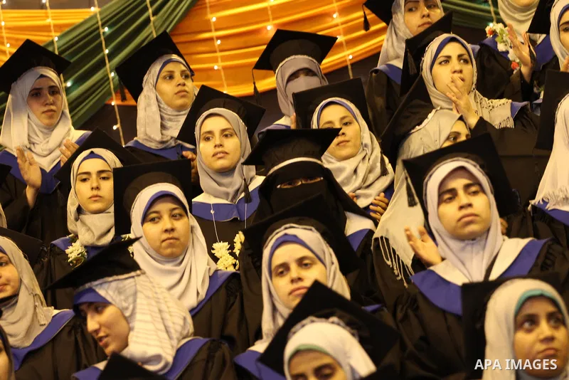 Palestinian students participate in their graduation ceremony at the University College of Applied Sciences in Gaza city on September 08, supposed to be involved 17 students were killed during air raids on the Gaza Strip...