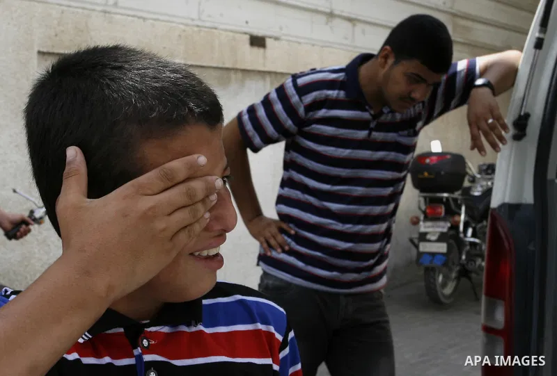 The brother of Saleh al-Riyati, who witnesses said was killed in an Israeli air strike, mourns during his funeral oustide Abu Yousef al-Najjar hospital, in Rafah in the southern in Gaza city, on Sep. 10, 2014. Photo by A...