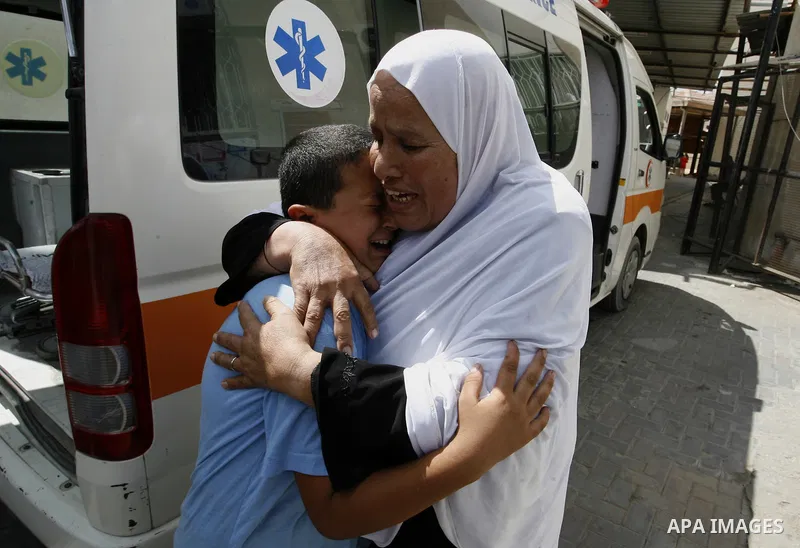 The Mother of Saleh al-Riyati, who witnesses said was killed in an Israeli air strike, mourns during his funeral oustide Abu Yousef al-Najjar hospital, in Rafah in the southern in Gaza city, on Sep. 10, 2014. Photo by Ab...