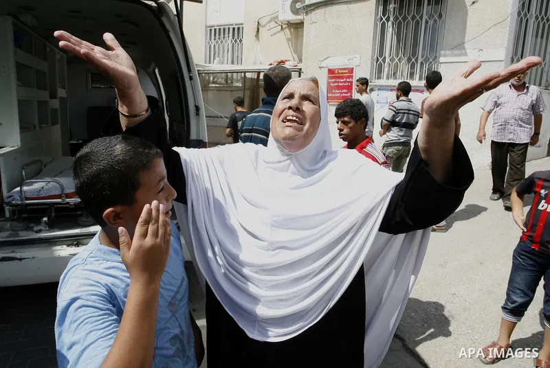 The Mother of Saleh al-Riyati, who witnesses said was killed in an Israeli air strike, mourns during his funeral oustide Abu Yousef al-Najjar hospital, in Rafah in the southern in Gaza city, on Sep. 10, 2014. Photo by Ab...