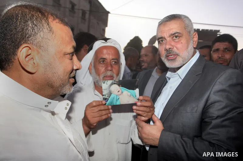 Senior leader of Hamas Ismail Haniyeh gets welcome during his inspection visit to the Deir al-Balah in the central Gaza Strip, on September 10, 2014. Hamas's exiled deputy leader said Wednesday that indirect talks with I...