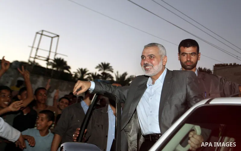 Senior leader of Hamas Ismail Haniyeh gets welcome during his inspection visit to the Deir al-Balah in the central Gaza Strip, on September 10, 2014. Hamas's exiled deputy leader said Wednesday that indirect talks with I...